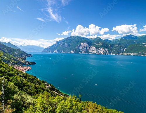 A scenic panoramic view capturing a pristine, vast lake embraced by mountainous terrain and a vibrant blue sky with fluffy clouds