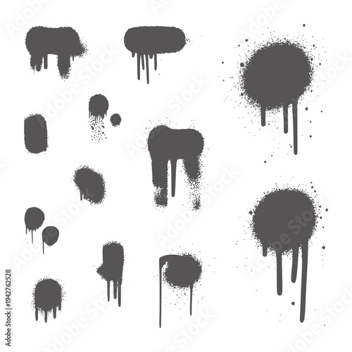 Collection of dark grey spray paint splatters and drips stain
