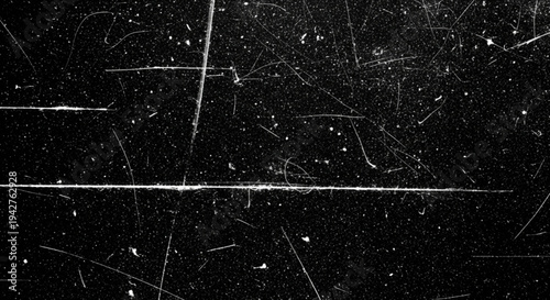 Dark cinematic background with prominent white scratches on the edges and scattered dust particles for a retro film aesthetic.