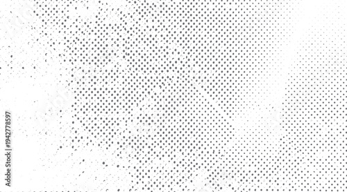 Grey dots pattern on white background with gradient density and scattered small circles
