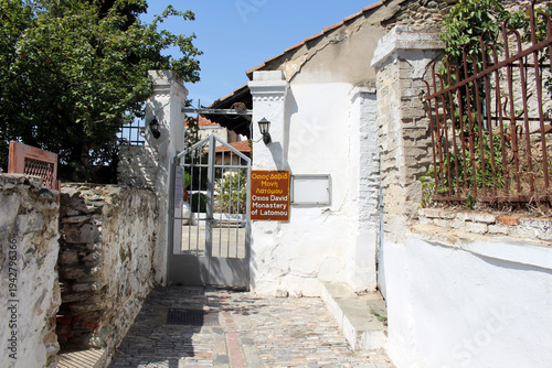 Latomou Monastery Hosios David August 2024 entrance with sign in Upper Town