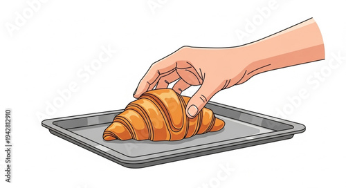 Hand placing croissant on baking tray.