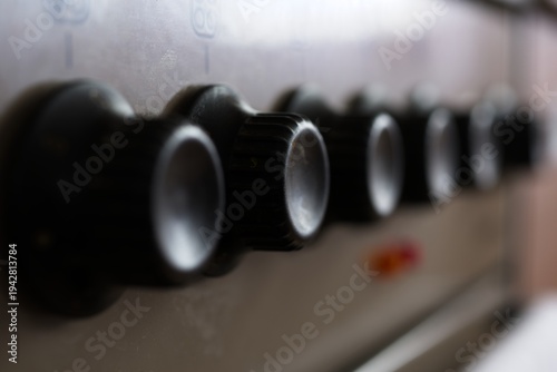 Cover lid edge close up with damage on casserole in kitchen, handle is out of focus