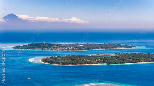 фотографія Aerial view of Gili islands with Mount Agung volcano in the distance, Indonesia