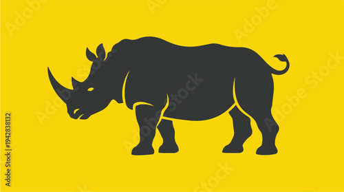 Silhouette of a Rhinoceros on a Bright Yellow Background.