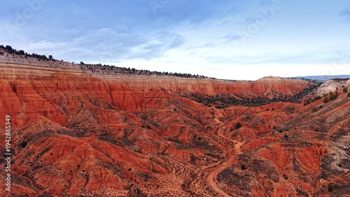 Red Canyon of Teruel, Spain set against overcast sky. Amazing tourist attraction from drone footage.