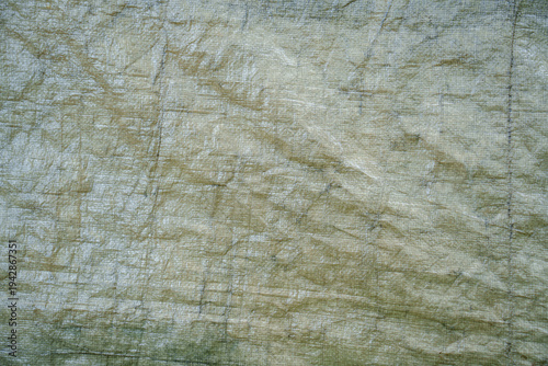 Weathered grey poly tarpaulin 
