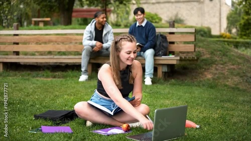Young Students Group Studying Together with Laptop in Park Outdoor Learning
