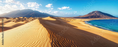 Wallpaper Mural Golden sand dune desert with blue ocean and mountain under bright sky, creating stunning and peaceful natural landscape Torontodigital.ca