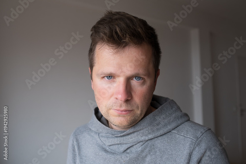 Bild auf Leinwand Mid Shot Emotional Portrait of a Middle Aged Man Looking Reproachfully at the Ca