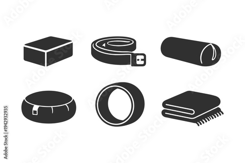 Collection of yoga and fitness accessories including block, strap, bolster, ring, and blanket