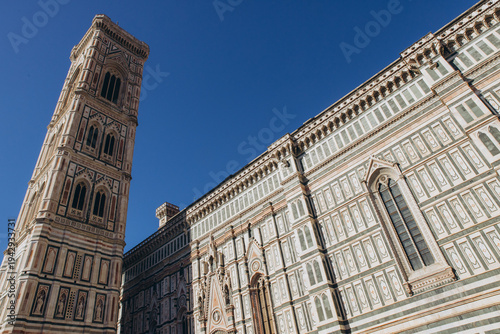 Obraz na płótnie Giotto's Campanile and Duomo di Firenze facades under clear blue sky, capturing