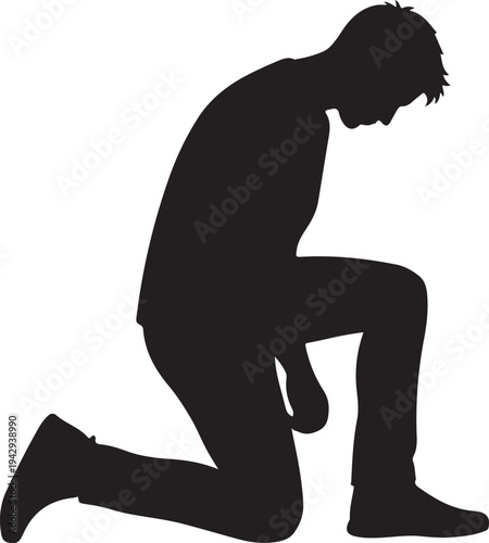 A man kneels on one knee in a contemplative pose