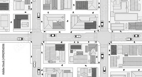 Aerial view of a city intersection with cars and buildings.