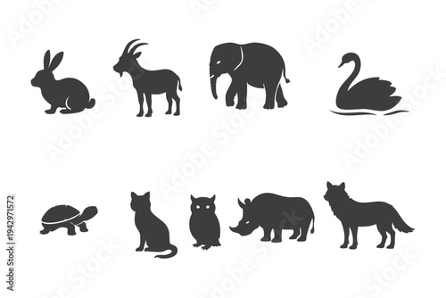 Animal silhouette set including rabbit, goat, elephant, swan, turtle, cat, owl, rhinoceros and wolf isolated