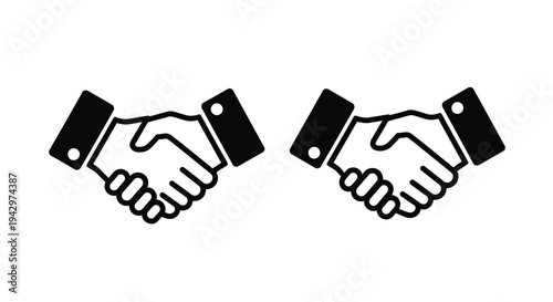 Two black handshakes depicted in a minimalist style silhouette