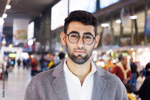 Germany, Munich, portrait of young businessman at central station