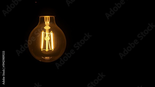 Abstract glowing light bulb symbolizing innovation against a dark atmospheric backdrop.