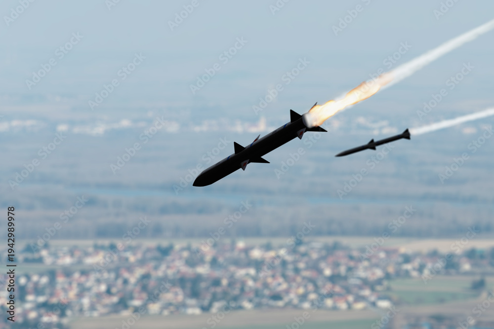 Obraz premium Cruise missile launches leaving bright flame trail in the sky.