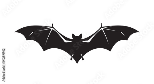 Black silhouette of a bat in flight with wide outstretched wings is isolated on a white background.