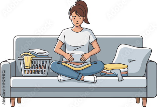 A woman sitting on a couch folding laundry from a basket