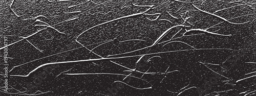 Abstract textured black background with white scratches