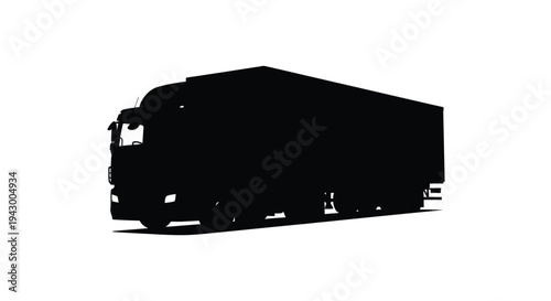 A striking black silhouette of a large transport truck