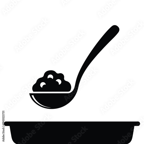 Ladle with food over a tray.