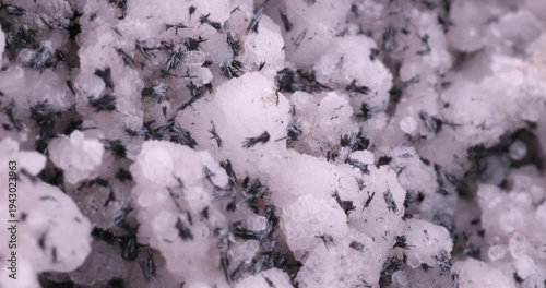 Black Manganite on Calcite. Specimen from N'Chwaning II Mine, Kalahari Manganese Field, South Africa. macro footage detail texture background. close-up mineral crystal unpolished semi-precious