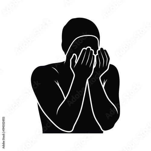 Silhouette of a person covering their face with hands.