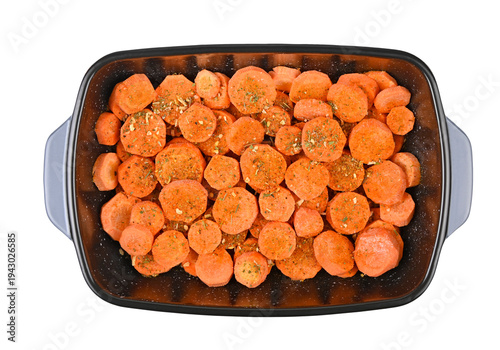 Sliced carrot in ceramic baking dish