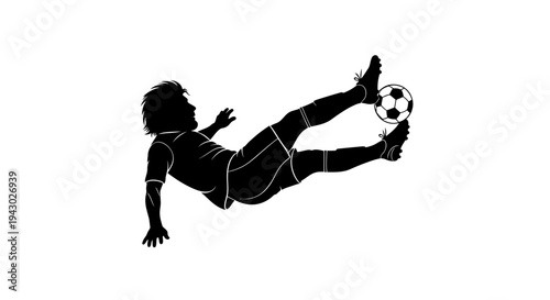 Silhouette of Soccer Player Kicking Ball.
