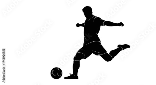 Silhouette of Soccer Player Kicking Ball.