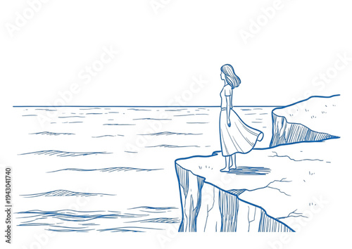 Woman in a flowing dress stands on a cliff edge overlooking the sea