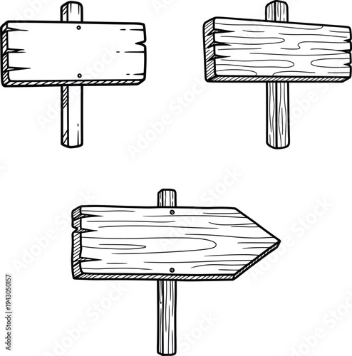 wooden signboards on posts in different orientations