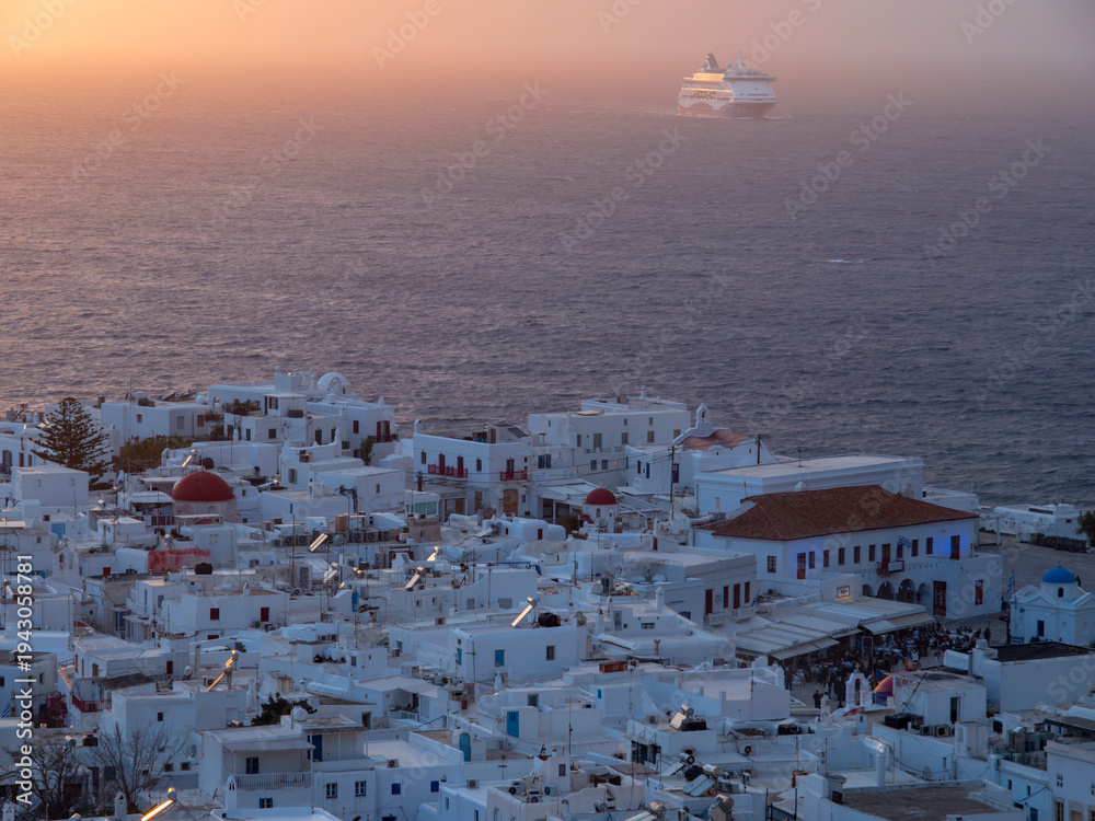Fototapeta premium Mykonos sunset view in the Aegean Sea and Cruise Ship in Greece