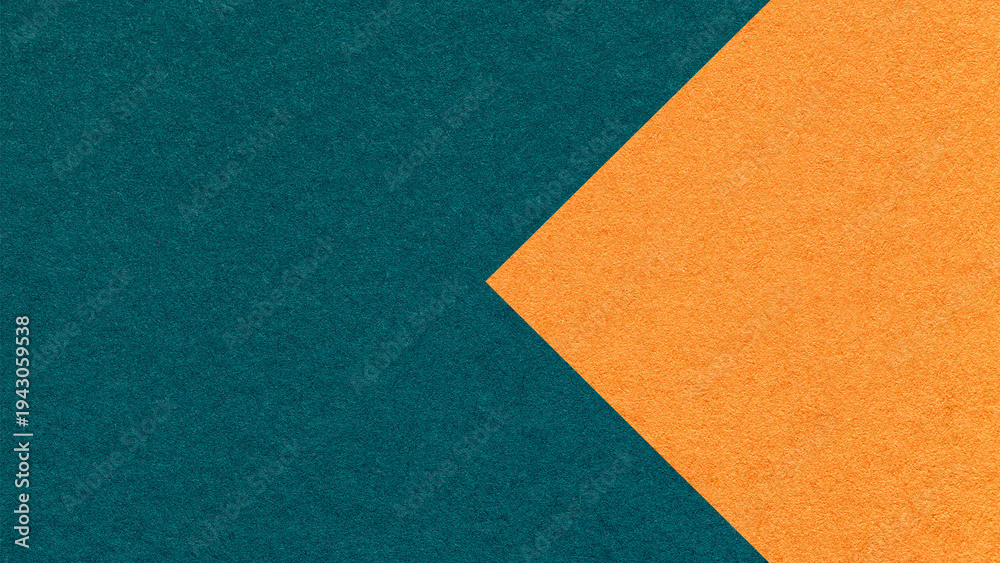 Fototapeta premium Textured dark teal paper background with orange arrow, macro. Template with copy space for banner, presentation