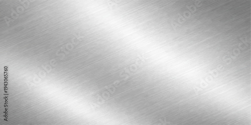 A shiny brushed metal plate features a polished silver stainless steel texture with a smooth industrial aluminum surface and light grey reflections on a metallic pattern wallpaper backdrop