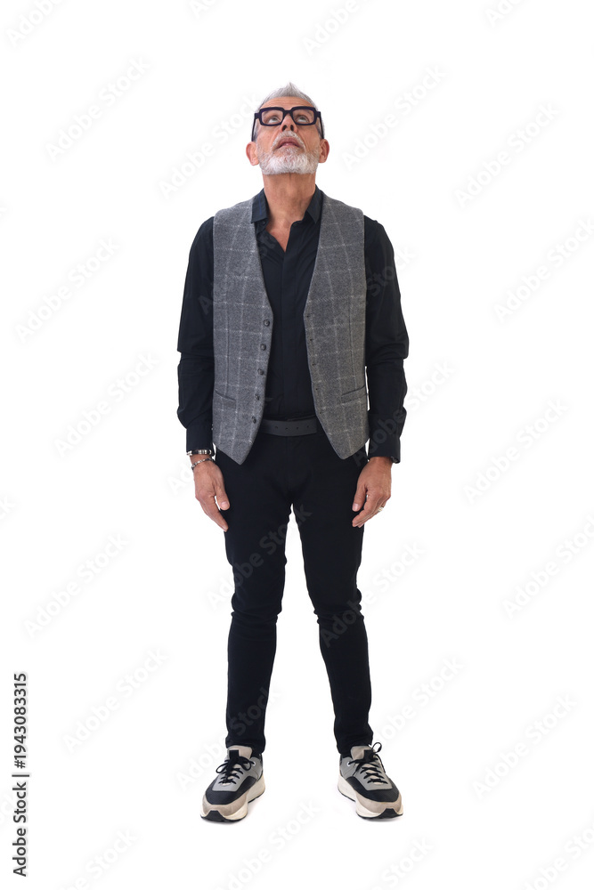 Fototapeta premium Front view of a modern retired man standing and look up on white background