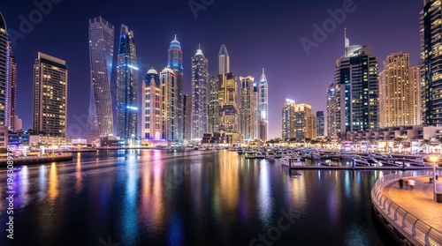 Wallpaper Mural Dubai skyline at night with illuminated skyscrapers reflecting on waterfront luxury marina and city lights Torontodigital.ca