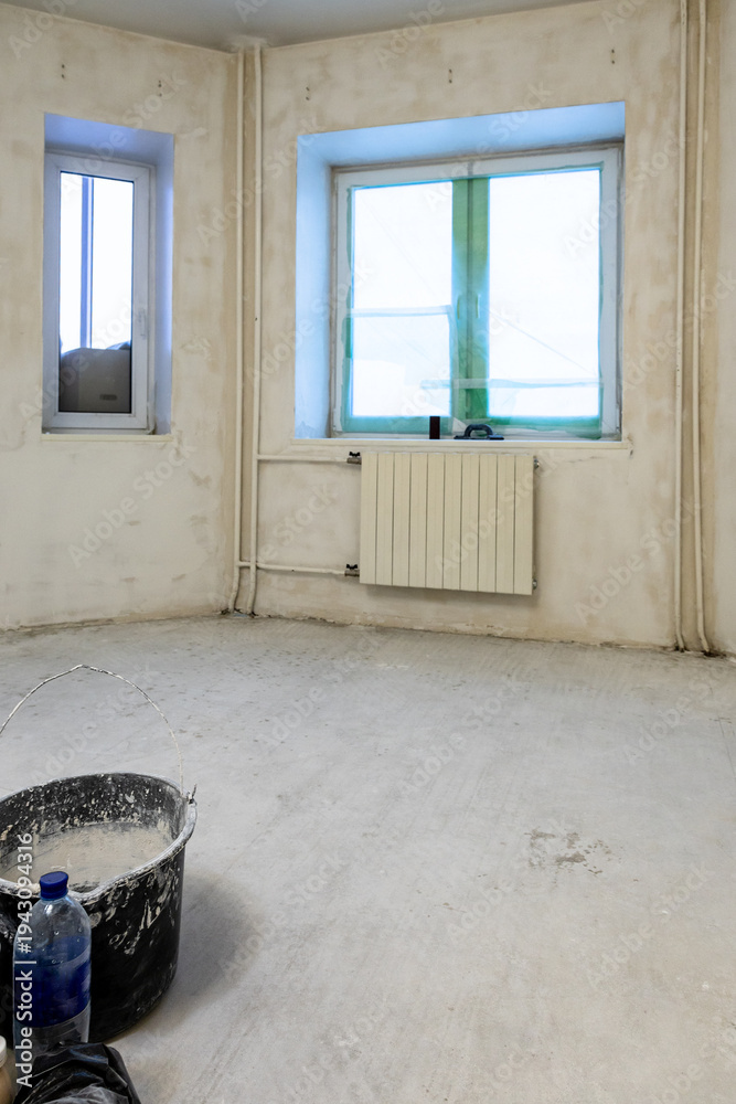 Φωτογραφία view of concrete room with rough finishing