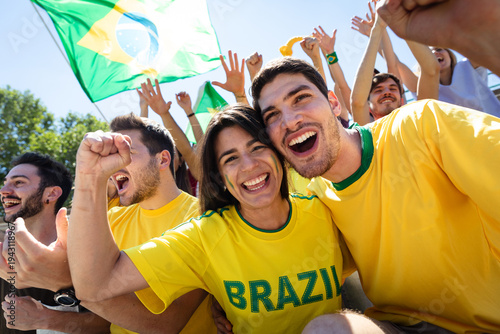 Brazil football fans cheering celebrating victory at stadium