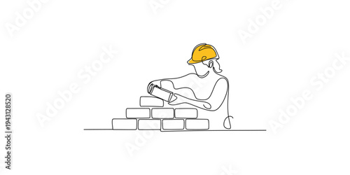 Man in hard hat laying bricks with trowel construction worker builder bricklayer mason building site