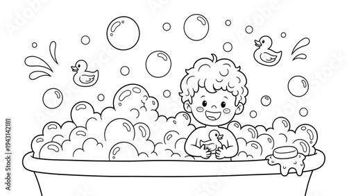 Cute happy boy taking a bubble bath with rubber ducks and soap