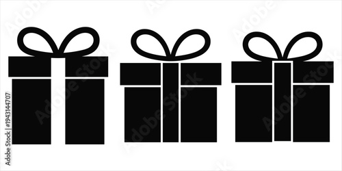 Three black gift boxes with bows on a white background present gifts