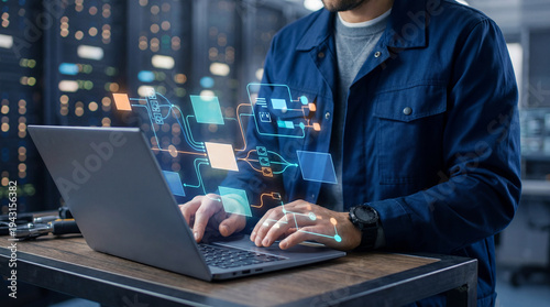 Data infrastructure and data pipeline development. Data integration. Engineer using laptop computer to design data processing system and data warehouse.