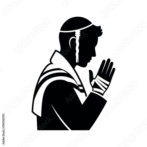 Jewish man praying with tallit and tefillin.