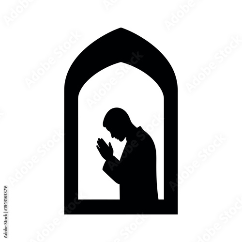 Silhouette of a Muslim man praying in an archway.