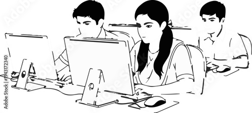 Three students focused on computer screens in a classroom setting