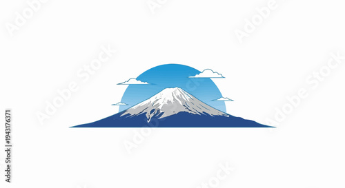 Majestic snow-capped peak rises above blue hills under a sunlit sky